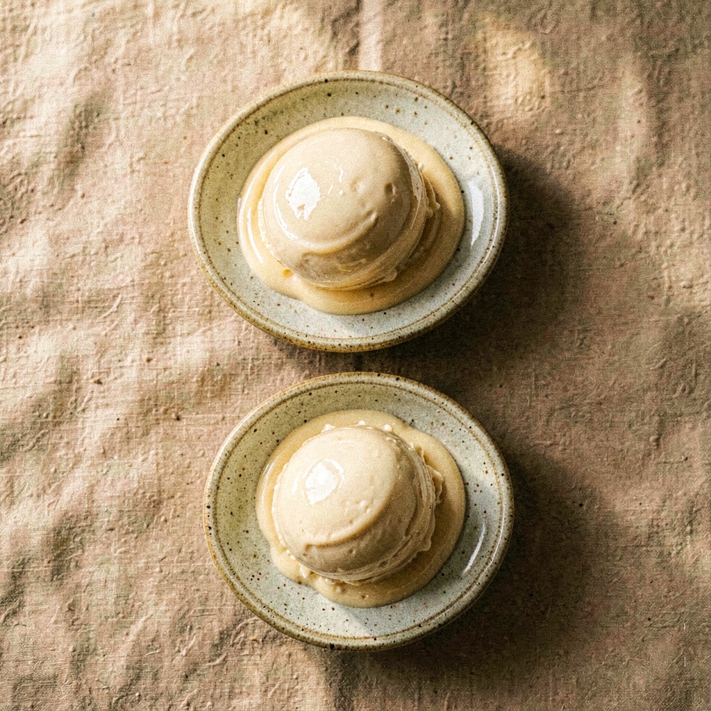 Top-down flat-lay of three small dishes of ice cream